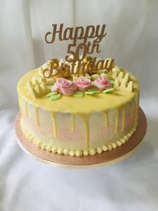 A three layered ten inch cake made with gluten free ingredients